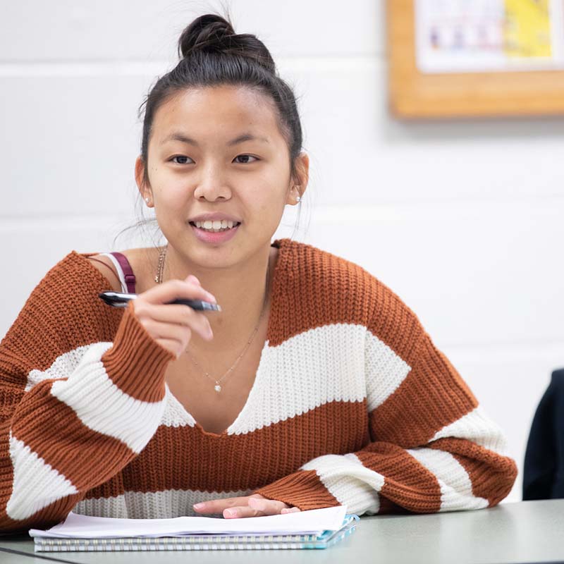 girl in front of smartboard