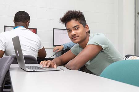 Photo of student at laptop